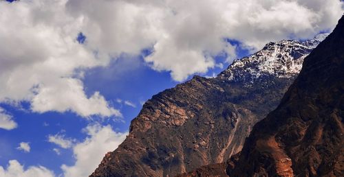 Low angle view of mountains against sky