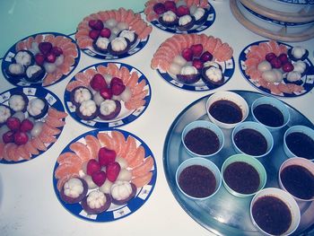 High angle view of fruits in plate on table