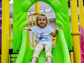Cute girl playing on slide