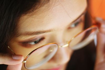 Close-up of woman wearing eyeglasses