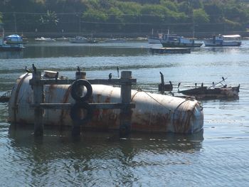 Fishing boat moored at riverbank