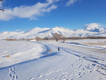 Scenic view of snowcapped mountains against sky