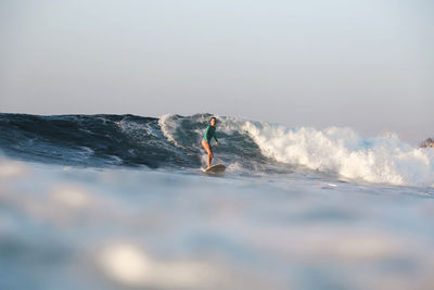 Female surfer on the wave
