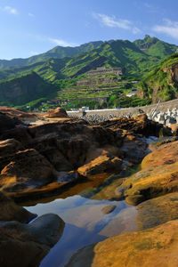 View of river passing through mountains