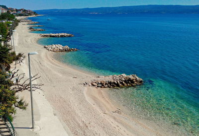 Scenic view of sea against blue sky