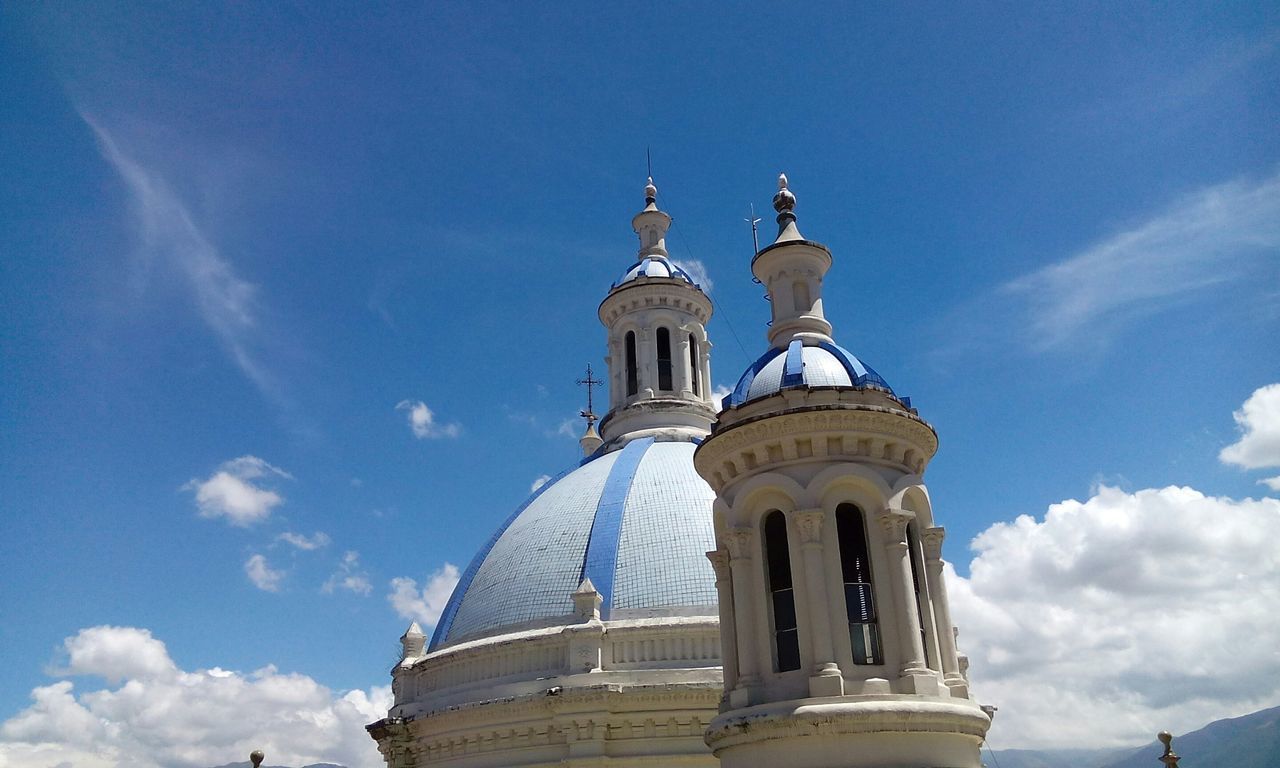 low angle view, architecture, built structure, building exterior, sky, blue, dome, place of worship, religion, spirituality, church, cloud - sky, famous place, cloud, high section, travel destinations, day, outdoors