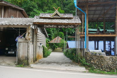 Footpath amidst houses and buildings