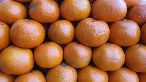 Full frame shot of oranges in market