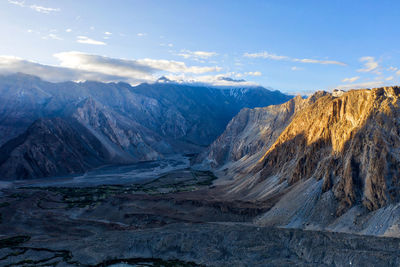 Scenic view of snowcapped mountains against sky