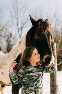 Portrait of woman with her horse