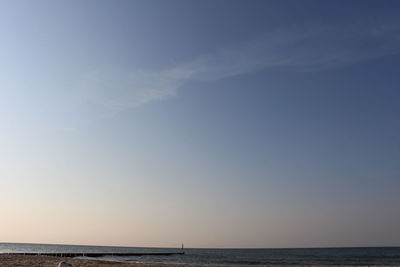 Scenic view of sea against blue sky