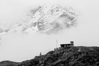 Scenic view of sea and mountains against sky