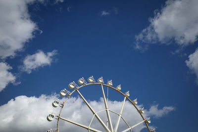 Low angle view of ferris wheel against sky