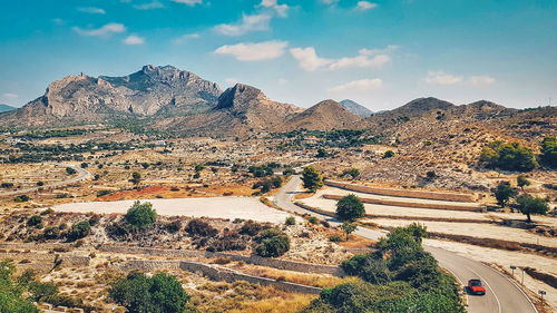 High angle view of road against cloudy sky