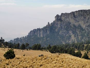 Scenic view of rocky mountains against sky