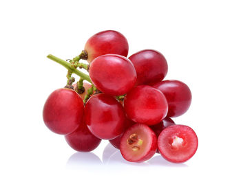 Close-up of grapes against white background