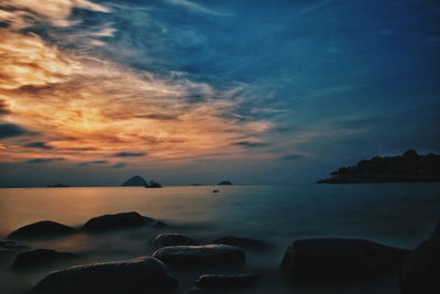 Scenic view of sea against cloudy sky