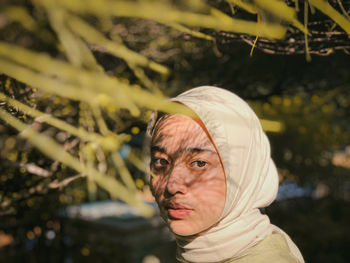 Portrait of woman looking at camera