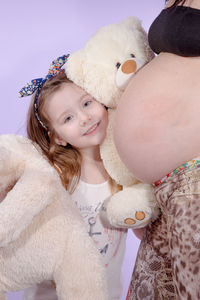 Portrait of cute girl with toy toys