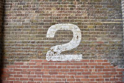 Information sign on brick wall