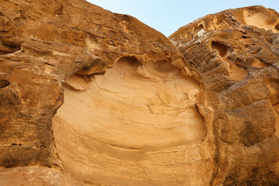 Texture of sandstone rock in little petra archaeological site, jordan