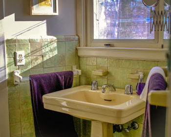 Ceramic sink in bathroom at home