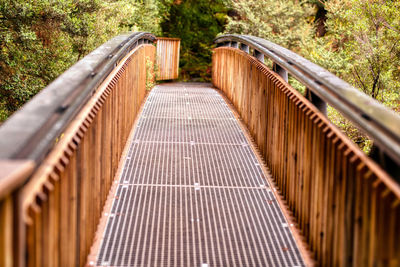 High angle view of footbridge amidst trees