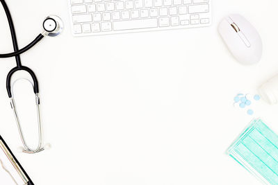 High angle view of white keyboard on table