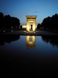 Reflection of building in water at night