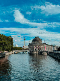 Buildings by river against sky, museumsinsel, river, blue sky 