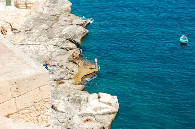 High angle view of rock formations in sea