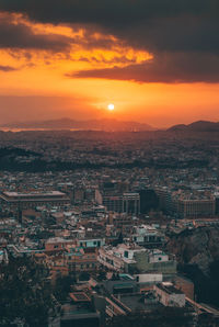 Aerial view of city during sunset