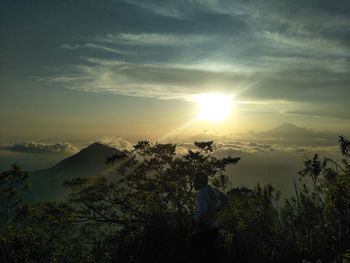 Scenic view of mountains against sky during sunset