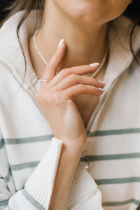 Midsection of woman with long hair