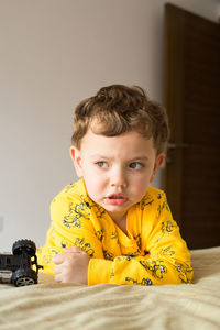 Portrait of cute boy with toy