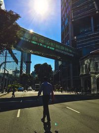 Sun shining through city