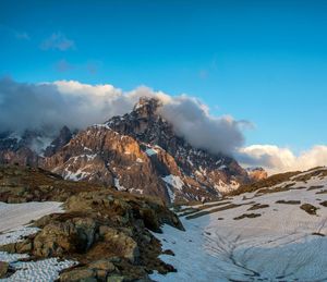 Scenic view of snowcapped mountains against sky