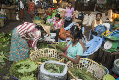 Venders selling betel leaves at market