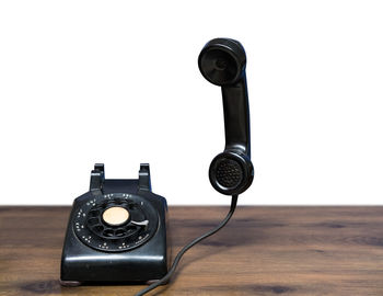 Close-up of telephone booth against white background