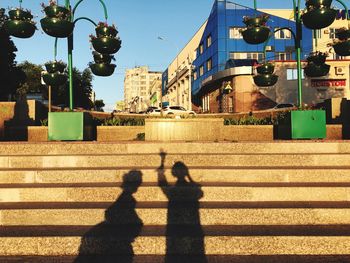 Shadow of people on street light