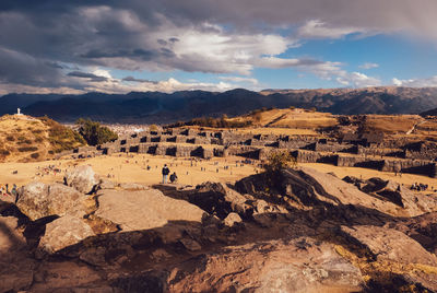 Scenic view of mountains against cloudy sky