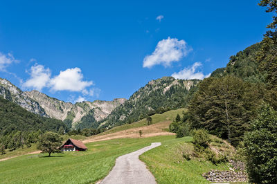 Panoramic view of landscape against blue sky