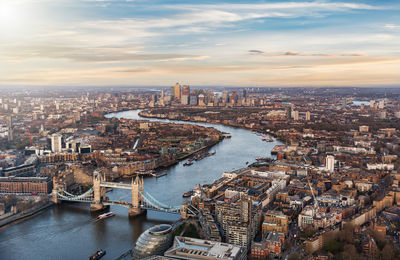 Aerial view of tower bridge over thames river amidst cityscape