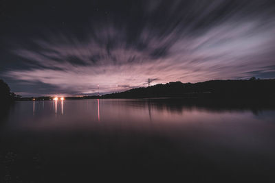 Scenic shot of calm countryside lake at night