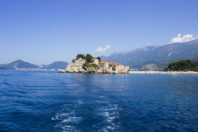 Scenic view of sea against blue sky