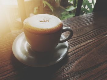 Close-up of coffee cup on table