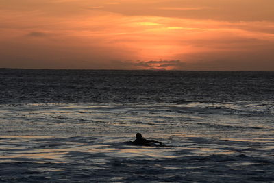 Scenic view of sea against sky during sunset