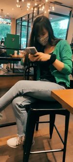 Man sitting on table in restaurant