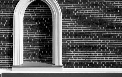 View of window on brick wall