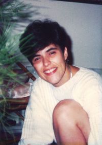 Portrait of smiling young man sitting outdoors